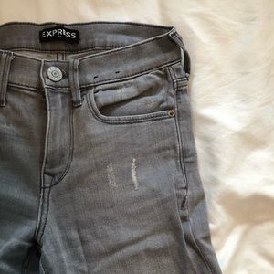 Distressed grey jeans